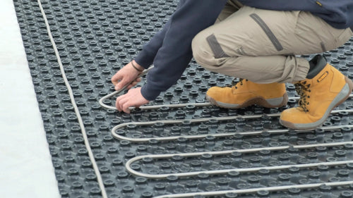 Installer forming Ridgeline stainless steel tube bends in castellated floor panels